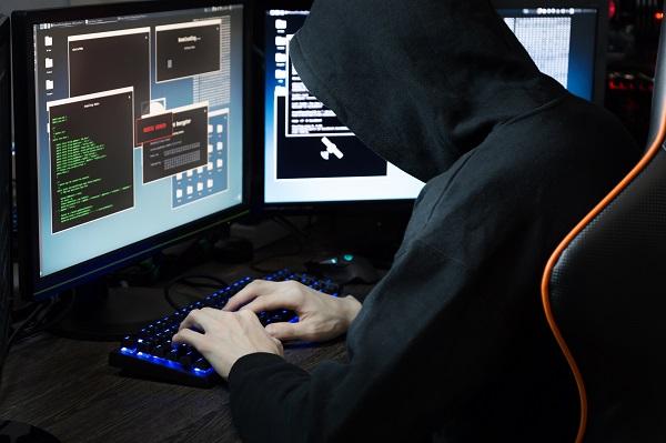 guy sits at computer screen