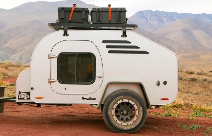 teardrop trailer on side of red dirt road