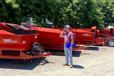 man stands next to equipment