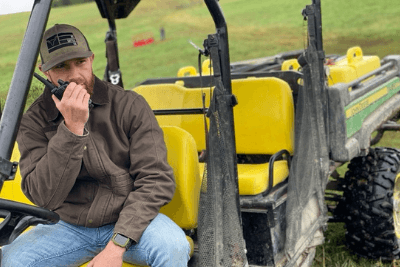 man talks on walkie on SXS