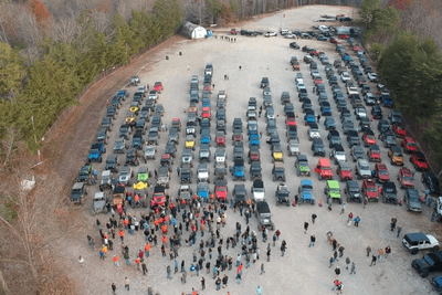 aerial shot of Jeeps and people lined up