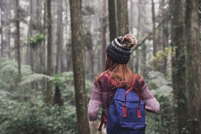 woman walks in forest