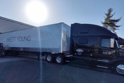 semi truck parked with "Brett Young" on side of trailer
