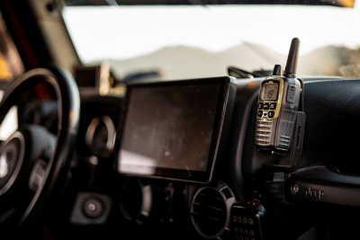 Jeep branded walkie talkie mounted on Jeep dashboard in vehicle
