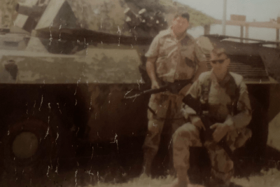 soldiers next to tank