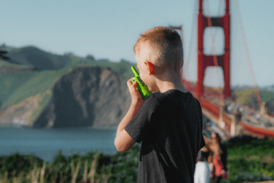 kid holds walkie talkie
