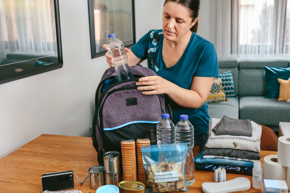 woman packs her emergency kit