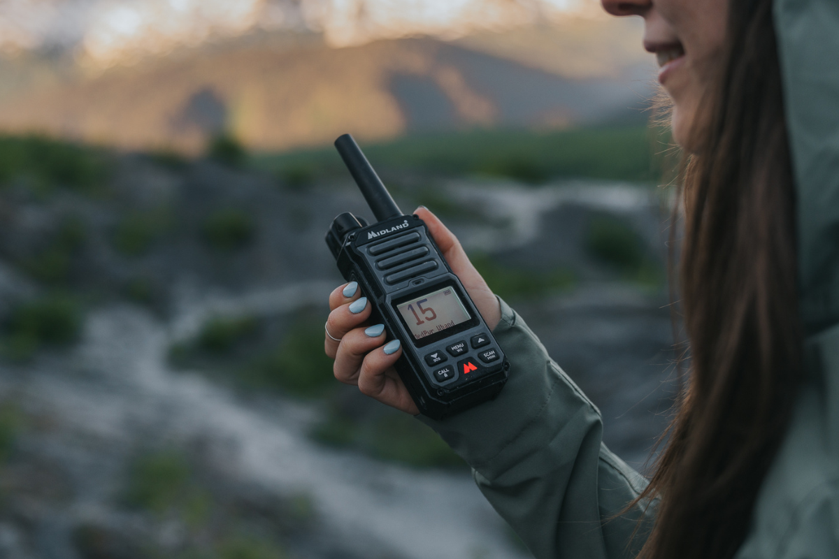 walkie talkie in hand