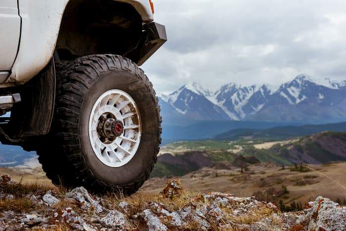 off-road vehicle wheel near mountains