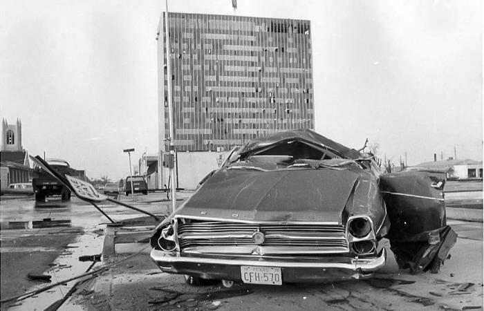 black and white image of tornado damaged car