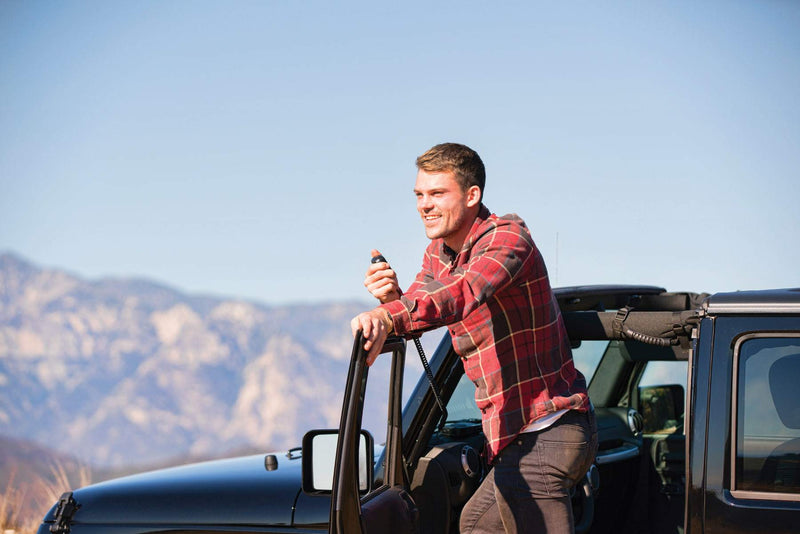 man uses MicroMobile mic outside vehicle