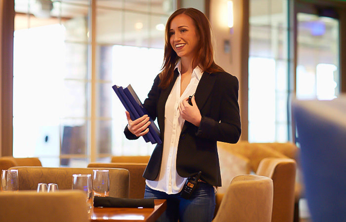 woman in restaurant on business radio