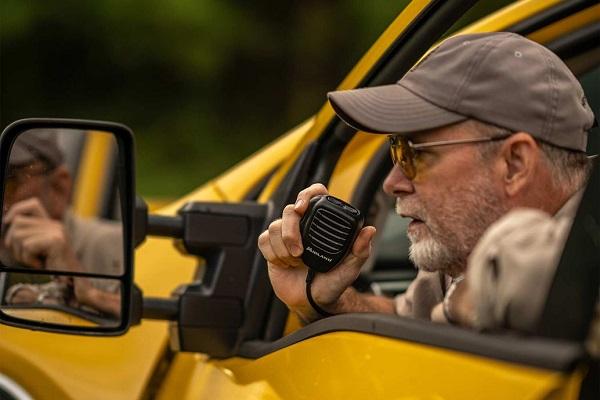 hunter uses radio mic out window of vehicle