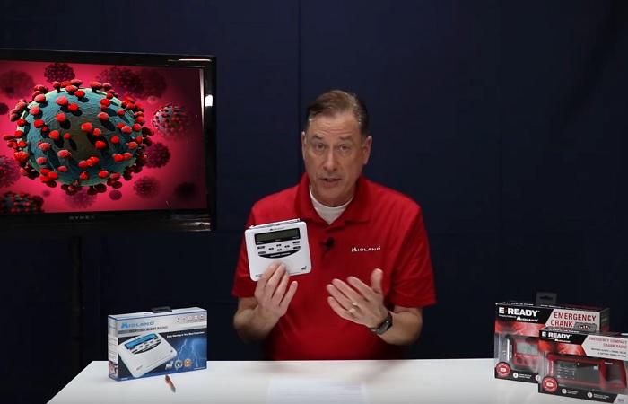 man holds weather radio