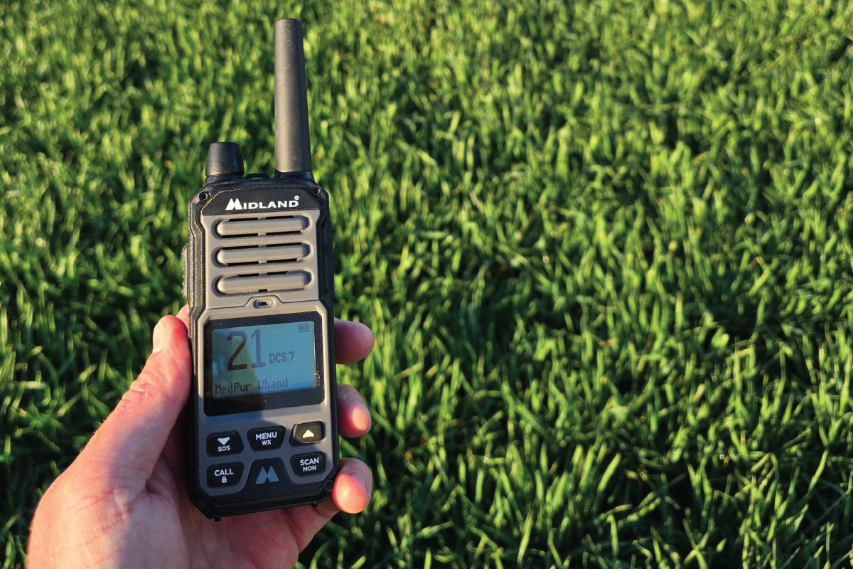 hand holds walkie talkie