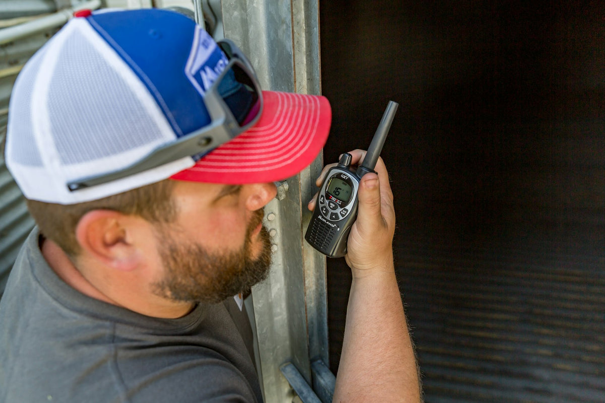 man uses walkie talkie