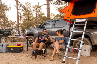 campers outside rooftop tent