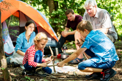 family outside tent