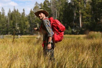 man in tall grass