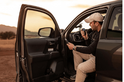 man sitting in vehicle with MicroMobile mic