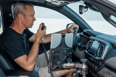 man uses MicroMobile mic in vehicle