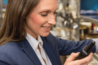 woman uses business radio