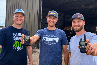 3 brothers holding walkie talkies