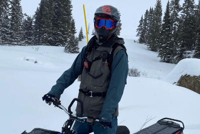 woman on snow mobile