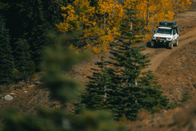 overlanding vehicle in the fall woods