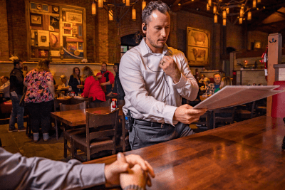 server uses business radio while talking to customers