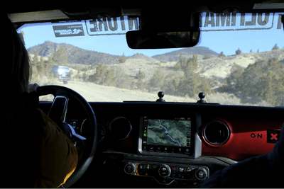 driver in cab of off-road vehicle