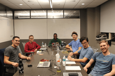 six college students sit around table