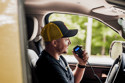 man uses MicroMobile mic in vehicle