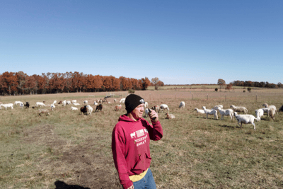 farmer uses walkie talkie on farm