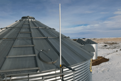 Repeater antenna on top of grain bin