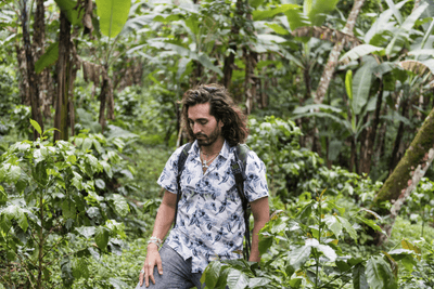 man hiking through forest
