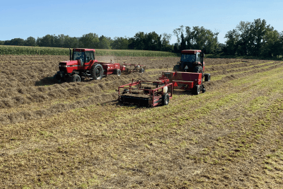 two tractors side by side in field