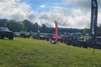 Jeeps lined up in grass