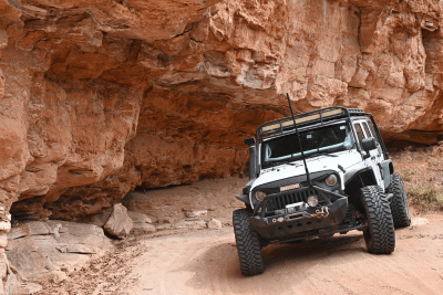 Jeep under rock of Palo Duro Canyon