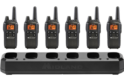 six business radios lined up with charger
