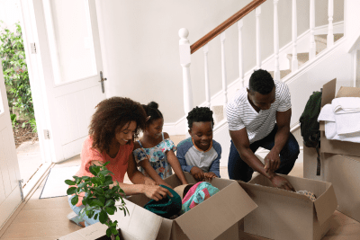 family looks at open boxes