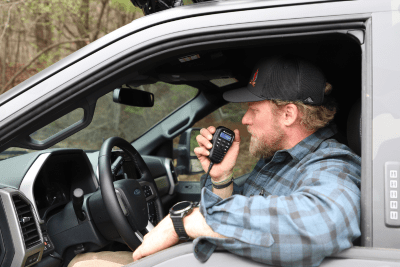 man uses MicroMobile mic in vehicle