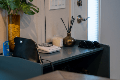 NOAA Weather Radio sits on table with purse and other trinkets