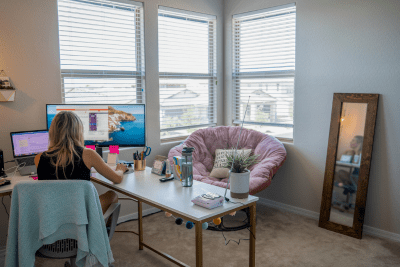 weather radio on desk while woman works