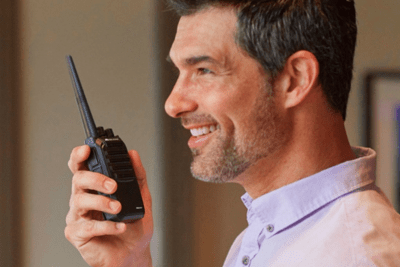 man holds business radio