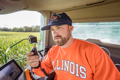 man holds MicroMobile microphone in combine