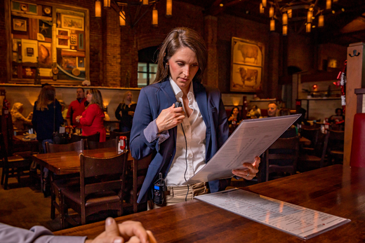 server uses business radio at table