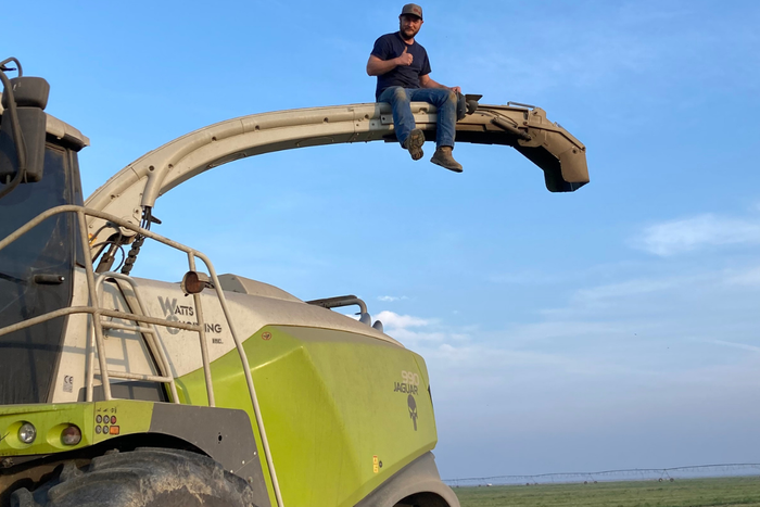 man on harvesting equipment