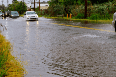 flooded road with cars