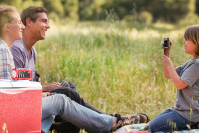 family outside with emergency radio
